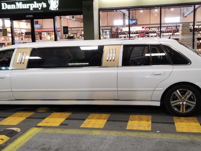 Our 9 seater white limo with gold trims has made a stop at Dan Murphy's
