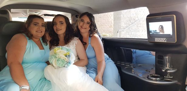 A photo of the bridal party inside one of our luxurious Limousines