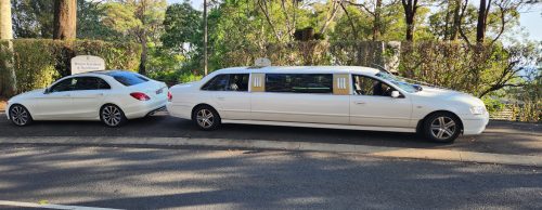 Mercedes Benz C250 Sedan and our 9 seater limo tail to tail. Beautiful pair!